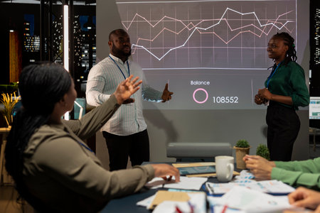 Team of company analysts reviews feedback on sales and orders to work on future improvements, developing marketing and PR strategies in meeting room. Startup enterprise management.の写真素材