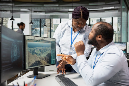 Team of technicians use AI assistant to analyze advanced wind turbine models, improving efficiency. Teamworking colleagues use artificial intelligence to create innovative VAWT turbine in CAD softwareの写真素材