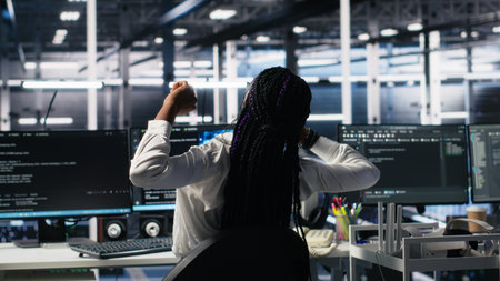 Data center manager checking work done by admins using deep learning to analyze datasets. Server hub supervisor overseeing IT specialists using AI neural networks to recognize data patterns, camera Aの写真素材