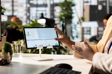 African american executive team are engaged in administrative tasks, reviewing progress reports and using data to ensure alignment with company objectives. Business management. Close up.の写真素材