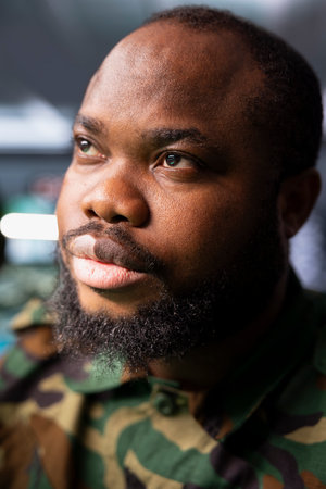 Air defense operative in war room using radar technology to detect incoming enemy missiles. Close up...
