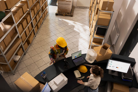 Diverse employees team managing storage inventory and preparing orders for dispatch, ensuring...