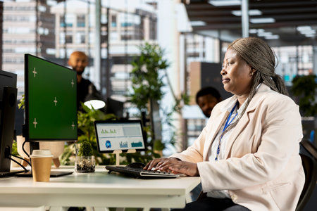African american employee brainstorming solutions for growth next to mockup, looking for global...