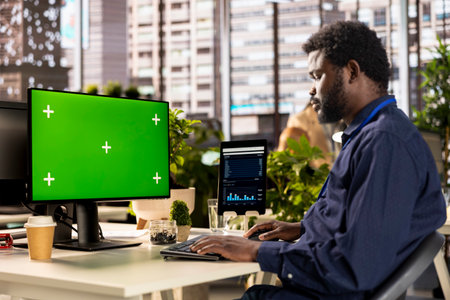 African american analyst finalizing a report with data analytics next to copy space, developing a...