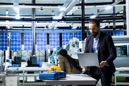General director in formal clothes evaluating factory workflow, combining business expertise and...