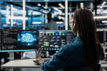 Engineer using AI computer to do checkup in server room providing vast computing resources and...