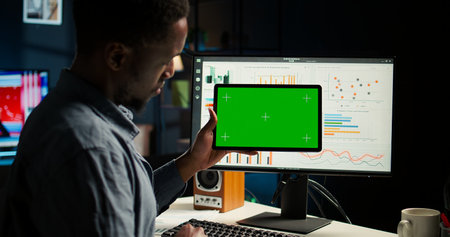 Male specialist reviewing financial elements next to copy space display, create strategic report for...