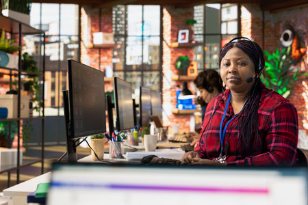 Portrait of call center agent using AI chatbot to provide quick and accurate replies to common...