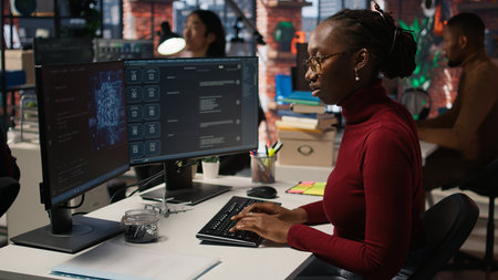 IT startup worker using large language model application to get help with coding tasks. Woman...