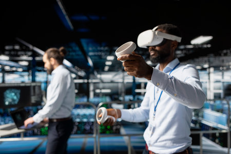 African american IT professional using VR technology to simulate AI neural network systems. Standing...