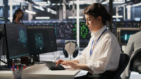 Cheerful data center engineers dancing in excitement in office chairs after successful AI...
