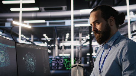 Engineer in data center reorganizing desk items at workstation to streamline workflow and boost...