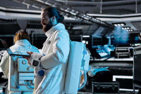 Astronaut wearing spacesuit inside futuristic spacecraft coordinating scientific research. Spaceman...