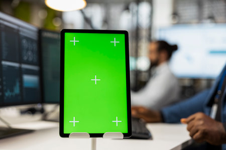 Close up of black worker examining insights with mockup on tablet, showcasing strategic mindset to business development tactics. Supporting innovation and goals achievement.の写真素材