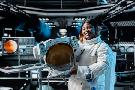 Portrait of happy female astronaut in orbital station analyzing Mars planetary data. Cheerful...