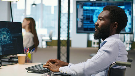 Computer scientist with paraplegia in office automating repetitive tasks with AI scripts. IT...