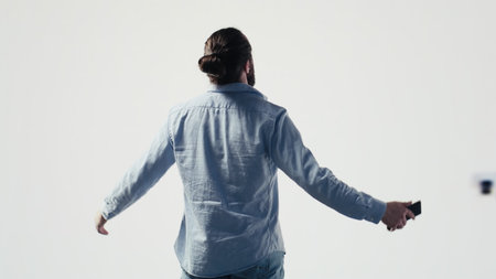 Male influencer checking mobile notifications and visual storytelling, engaging with followers on...
