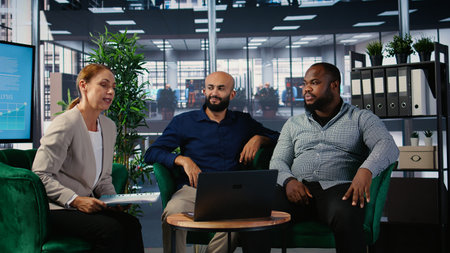 Corporate meeting where multicultural partners collaborate through video call, applying strategic thinking and teamwork to align goals and support career and company success.の写真素材