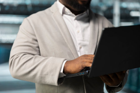 Close up of admin in data center workspace running system diagnostic tests, monitoring performance. IT expert in server hub looking for network issues affecting rigs performance, upgrading hardwareの写真素材