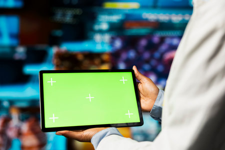 Close up of researcher using isolated screen tablet, looking at medical data, doing disease prevention. Scientist doing treatment development, looking at patient scans on mockup device applicationの写真素材