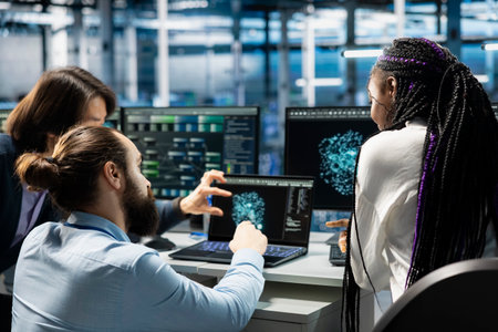 Data center coworkers collaborating, managing AI training datasets. IT staff members working...