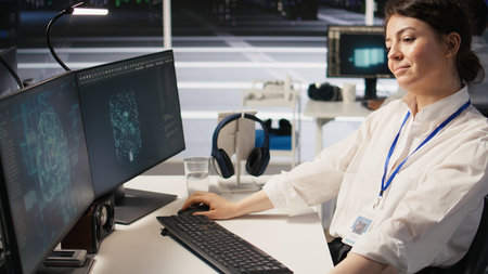 Data center developer thinking how to improve AI supercomputers, pleased with result. Cheerful...