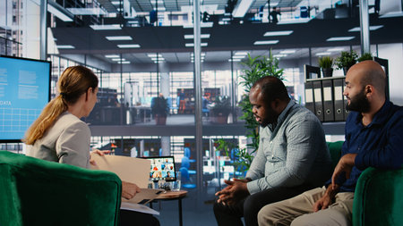 Corporate video call featuring teamwork among diverse business associates, using online web communication for decision making and collaboration. Strategic planning for growth. Camera A.の写真素材