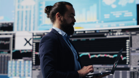 Surrounded by fintech data and forecasting models, skilled entrepreneur analyzing reports and insight to drive business growth. Company productivity and smart decision making. Camera A.の写真素材