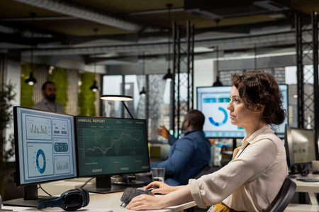Professional analyst engaged in planning and analysis with computer results to create strategy...