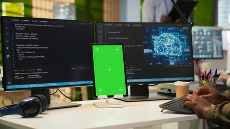 Admin using isolated screen tablet to code AI algorithms debugging software issues and improving...