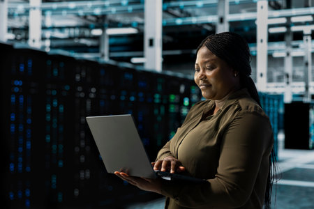 Smiling engineer does maintenance on data center electronics processing large datasets. Happy server...