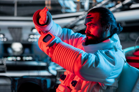 Worried astronaut in spaceship using hands to protect himself from alien attack triggering red light...