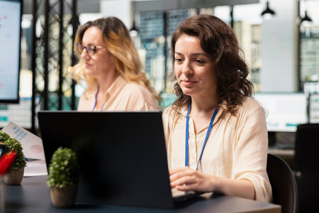 Female business entrepreneur works in boardroom and solving tasks, immersed in report writing during...