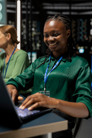 Team leader evaluating forecasting data insights to increase business profit, reviewing market sales trends to create a global development plant. Corporate associates after hours in office.の写真素材