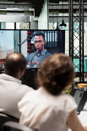 Team members attends an online video call meeting with applicant, evaluating past work experience and abilities suitable for empty position requirements. Remote employment process.の写真素材