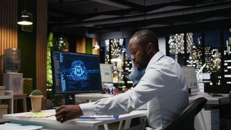 African american worker checking KPI metrics data with artificial intelligence tools on pc, working with AI neural networks for machine learning. Emphasizing innovation.の写真素材