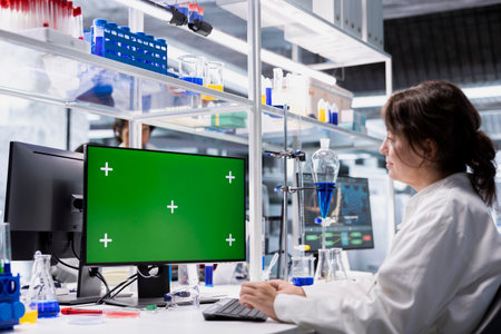 Isolated screen PC used by research facility specialist evaluating genetic markers associated with...