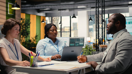 African american candidate signing employment contract during interview with HR manager and...