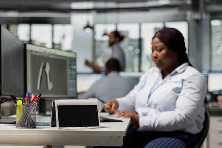 Close up of solar gadget on office desk built to support eco technology adoption. Solar powered prototype tested by researcher working on on clean energy innovationsの写真素材