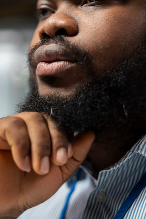 Close up of equity analyst in office doing audit of company earnings reports to forecast stock performance. Man monitoring industry trends and company news for investment insightsの写真素材