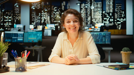 Businesswoman in the office engages in communication during virtual presentation, talking to...