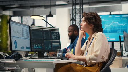 Business consultant focusing on global expansion strategy and planning resource allocation for organization, using digital tools to forecast insights and achieve corporate growth. Camera B.の写真素材