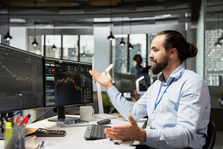 Joyous prop firm trader in officer celebrating after making successful market prediction and making...