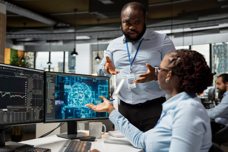 Manager supervising work of financial expert in office using large language model for stock exchange analysis. Supervisor oversees worker integrating machine learning analytics to monitor stock marketの写真素材