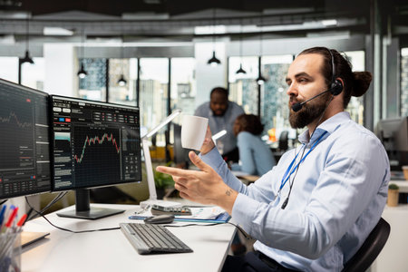 Financial advisor in office talking in mic, working with clients to develop personalized investing...