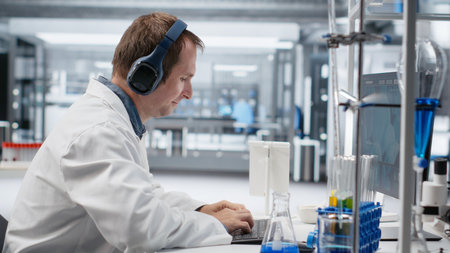 Unconventional scientist listens to music while conducting experiment in a science lab, wearing...