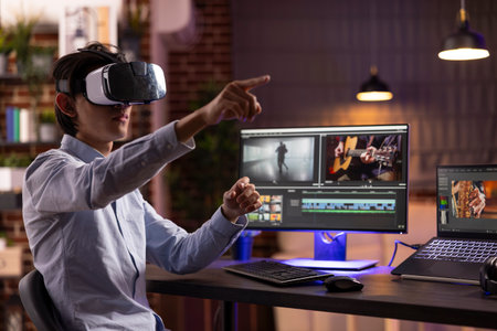 Asian man immersed in creative workflow, editing movie footage and visual effects in augmented...