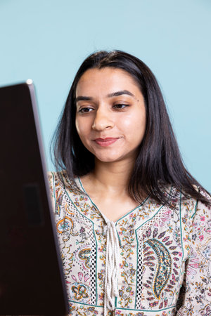 Casual cheerful woman chatting with her friend over video conference online, enjoying relaxation...