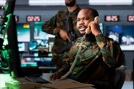 Military officer reporting battlefield information to army decision makers during telephone call....