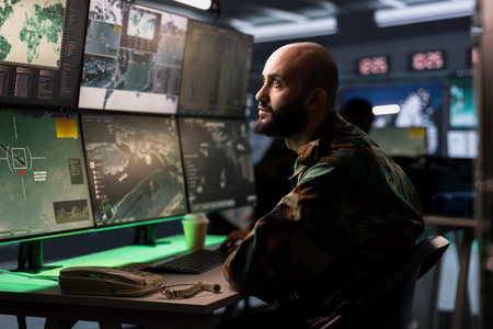 Military early warning systems operator in command center monitoring incoming enemy aerial attacks....